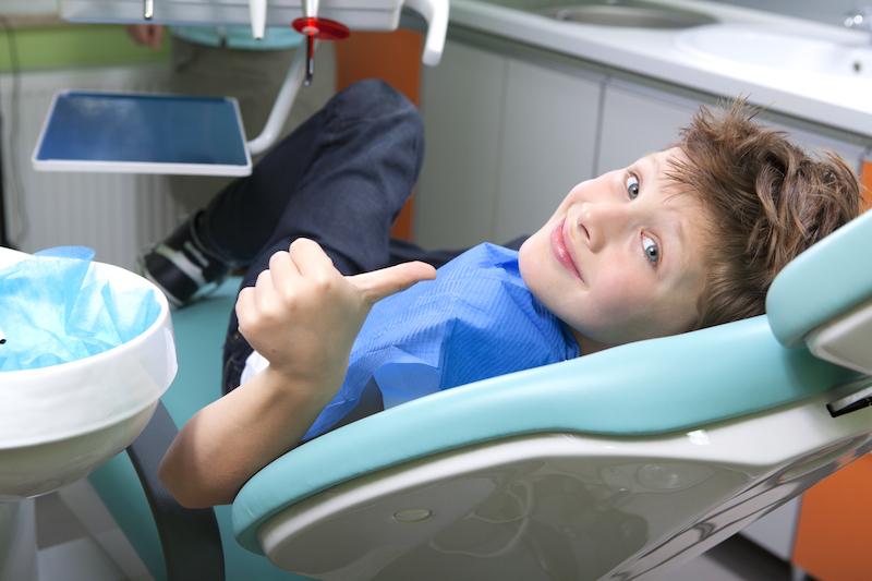 Young patient sitting in chair at Springfield pediatric dentist