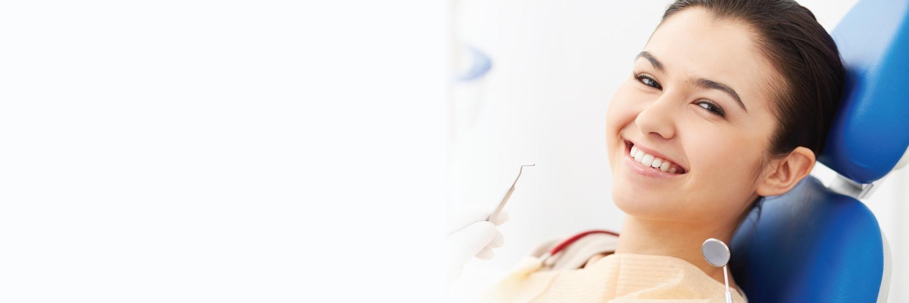 Woman smiling in treatment chair for dental emergency near 62704