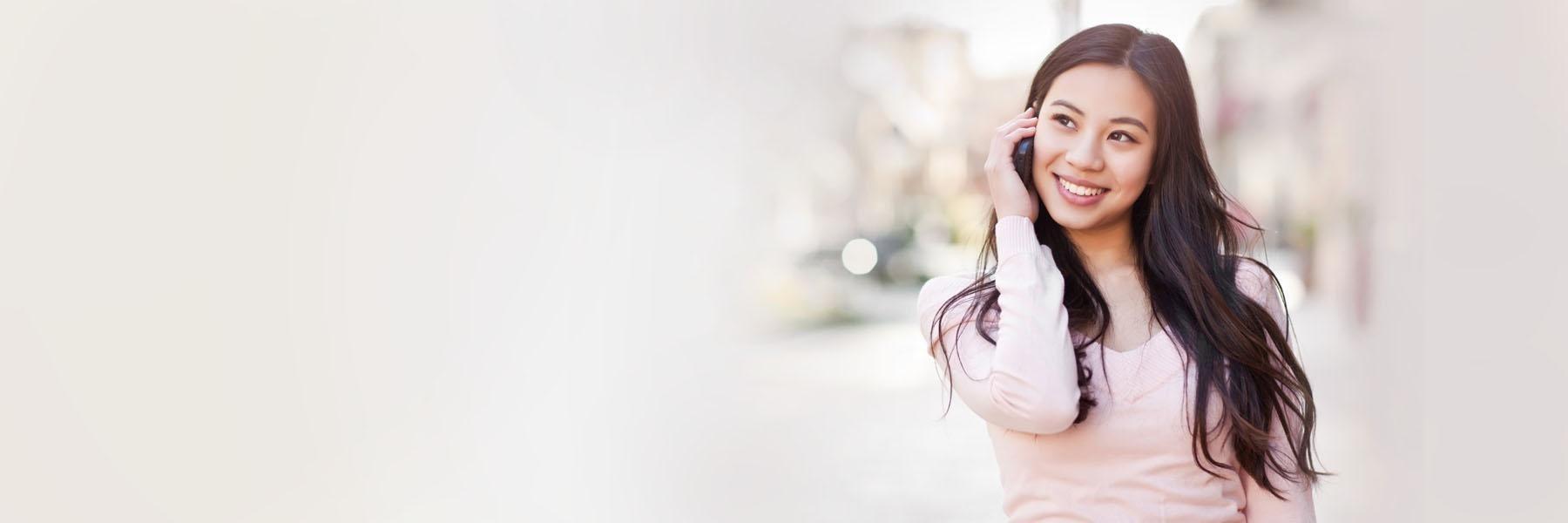 Woman on the phone calling emergency dentist in Springfield, IL